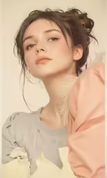 a woman with an intricate hair piece next to her