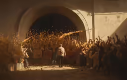 a crowd of people watching an event with one person in front of them