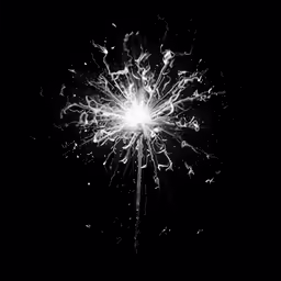 a fireworks stick is illuminated by the light of the candle