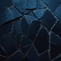 an artistic photograph of some very unique black and grey tile