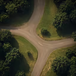 aerial view of road intersection through a large field