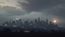 view from a hill of a city at night