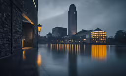 a clock tower towering over the city at night