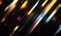 an abstract image of many colors of stripes