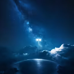 a cloudy field with a bright light up sign above it