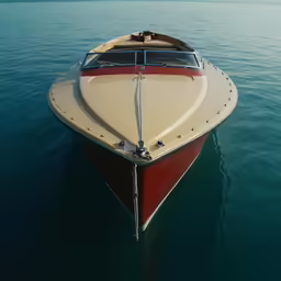 a boat anchored in the water during the day