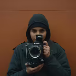 a person holding a camera in their hands