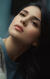 woman sitting wearing a sweater looking sideways