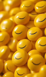 yellow candies with smiles drawn on them