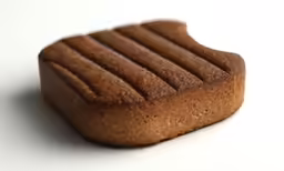 closeup of an assortment of cookies with slices taken out