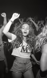 a group of people dancing with some holding hands