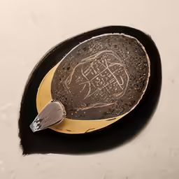 a dish with a carving in the center