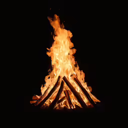a bonfire with many logs in it