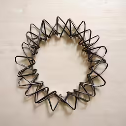 an arrangement of a circular object with lots of small metal objects