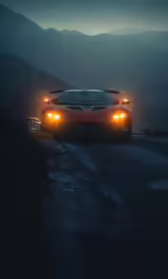a car driving on a wet road with lights