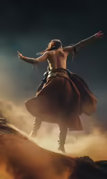 the young man has his hands in the air as he stands on top of the mountain