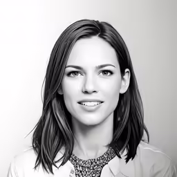 black and white photo of a women wearing a neck tie