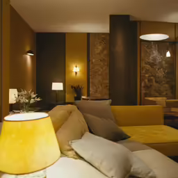 a modern, well lit living room that looks like a hotel