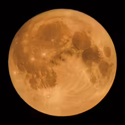 a large yellow full moon on black sky