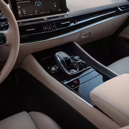the interior of a bmw car with an automatic radio and a gear selector