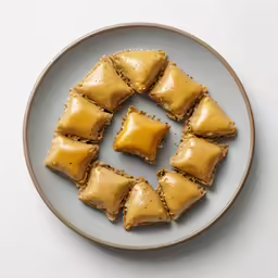 a plate with four squares of crackers on it