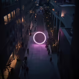 many people are walking in the city at night with lights