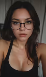 woman with very large breast and glasses posing