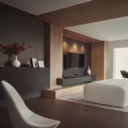 a large modern looking bedroom with white furniture