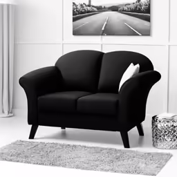 a black and white photo of a modern couch