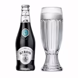 the beer is next to a tall glass