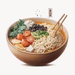 a big bowl with noodles, carrots, cheese and lettuce in it