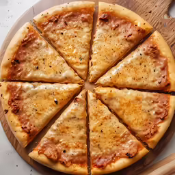 sliced pizza sitting on top of a wooden cutting board