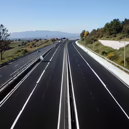 an expressway with several lanes leading to the exit