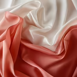 a peach and white silk fabric that is soft and smooth