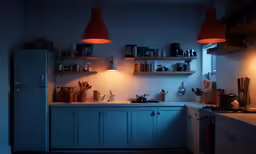 a kitchen with a stove, cabinets and lights