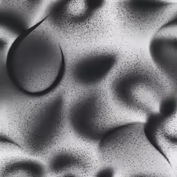 a wall made up with dark spots and dots
