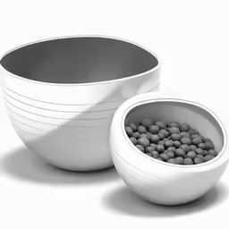 three white bowls sitting on top of each other