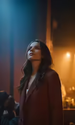 the woman stands alone with her eyes closed