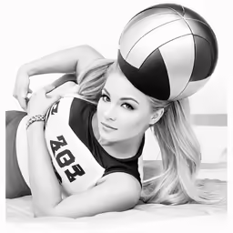 a woman with a volleyball hat is laying on a bed