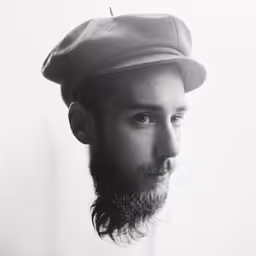 a man with a beard and a hat