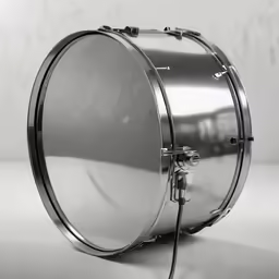 a stainless steel drum stands on a white background