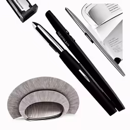 a black and white photo of some pen and scissors