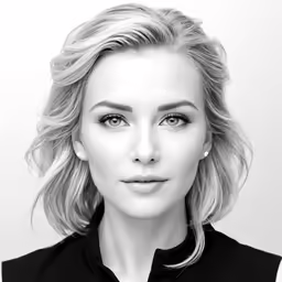 the woman is wearing a black top and posing for the camera