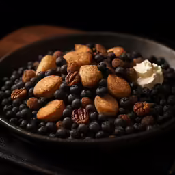 a black plate with some different kinds of food on it
