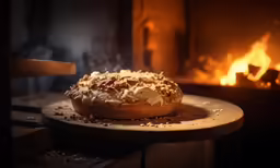 a pot with food is on a tray in front of the fire