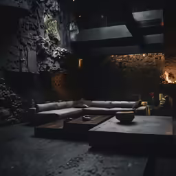 a living room area with large couches and candles