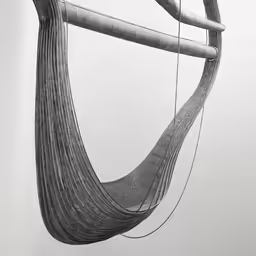 a big wooden sculpture sitting next to a forest
