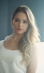 a beautiful woman wearing a white top