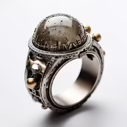 the ring is made from metal with beads and charms