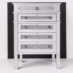 the nightstand table is white with silver accents